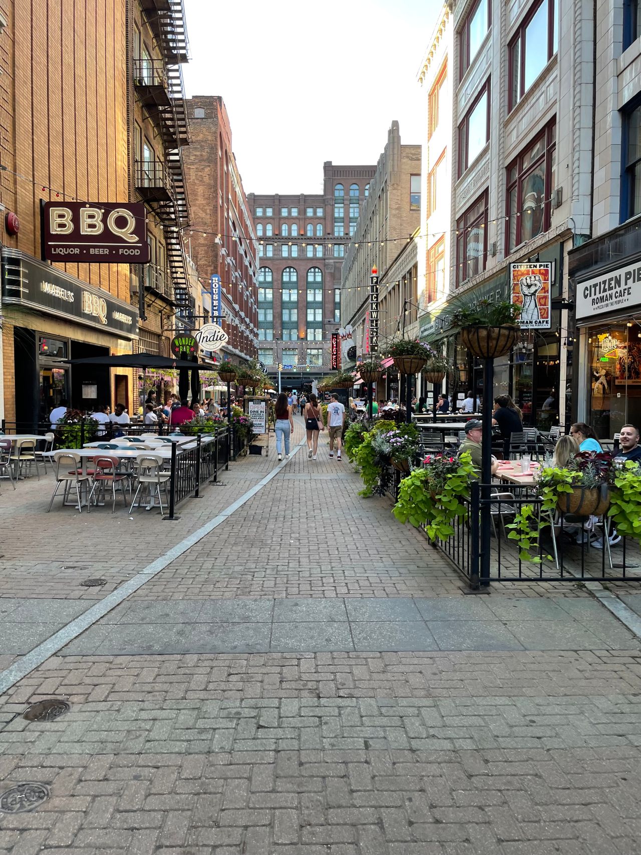 East 4th Street in downtown Cleveland on a summer evening, patios full and string lights overhead